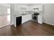 Well-lit kitchen featuring stainless steel appliances and bright white cabinets at 5480 Walnut Ln, Lithonia, GA 30038