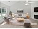 Bright living room with neutral tones, fireplace, and large windows at 5480 Walnut Ln, Lithonia, GA 30038