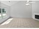 Airy living room with fireplace and large bright window at 5480 Walnut Ln, Lithonia, GA 30038