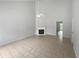 Spacious living room features vaulted ceilings, a fan, and a fireplace at 5480 Walnut Ln, Lithonia, GA 30038