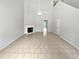 Living room features a vaulted ceiling, fireplace, and neutral tile floors at 5480 Walnut Ln, Lithonia, GA 30038