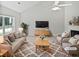 Cozy living room with large window, fireplace and ceiling fan at 5480 Walnut Ln, Lithonia, GA 30038