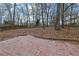 View of the backyard with a brick patio at 954 Josie Ct, Lawrenceville, GA 30045