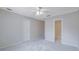 Neutral bedroom features plush carpet, a ceiling fan, and ample natural light at 954 Josie Ct, Lawrenceville, GA 30045
