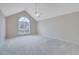 A spacious bedroom with vaulted ceiling, large window and plush carpeting at 954 Josie Ct, Lawrenceville, GA 30045