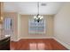 Breakfast nook boasts hardwood floors and a modern light fixture at 954 Josie Ct, Lawrenceville, GA 30045