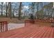 Wooden deck with railings overlooking a wooded area at 954 Josie Ct, Lawrenceville, GA 30045