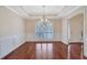Spacious dining room features hardwood floors and a modern chandelier at 954 Josie Ct, Lawrenceville, GA 30045