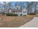 Charming home with stone accents, a cozy front porch, and manicured landscaping at 954 Josie Ct, Lawrenceville, GA 30045