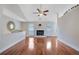 Spacious living area with hardwood floors, a fireplace, and ample natural light at 954 Josie Ct, Lawrenceville, GA 30045