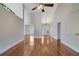 Light-filled living area showcasing hardwood floors and views into the dining room at 954 Josie Ct, Lawrenceville, GA 30045