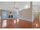 Bright living room features a fireplace, ceiling fan, and hardwood floors at 954 Josie Ct, Lawrenceville, GA 30045