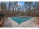 Covered pool in backyard surrounded by a concrete patio at 954 Josie Ct, Lawrenceville, GA 30045