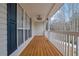 Relaxing porch with wood flooring and white railings at 954 Josie Ct, Lawrenceville, GA 30045