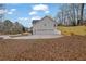 Back exterior featuring three-car garage, and well maintained fenced-in backyard at 954 Josie Ct, Lawrenceville, GA 30045