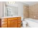 Well-lit bathroom featuring a vanity with storage, large mirror, and a combined shower and bathtub at 2252 Limehurst Ne Dr, Atlanta, GA 30319