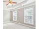 Carpeted bedroom with trey ceilings and large bright windows at 2252 Limehurst Ne Dr, Atlanta, GA 30319