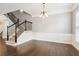 Dining area with hardwood floors, decorative molding, and elegant chandelier fixture at 2252 Limehurst Ne Dr, Atlanta, GA 30319