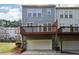 Back exterior view of home showing the garage, deck, and siding at 2252 Limehurst Ne Dr, Atlanta, GA 30319