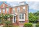 Beautiful two-story townhome featuring brick and stone accents with manicured landscaping at 2252 Limehurst Ne Dr, Atlanta, GA 30319