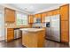 Modern kitchen with stainless steel appliances, granite countertops, and island feature at 2252 Limehurst Ne Dr, Atlanta, GA 30319