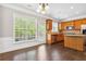 Bright kitchen features stainless appliances, wooden cabinets and island with a door leading to outside at 2252 Limehurst Ne Dr, Atlanta, GA 30319