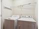 Bright laundry room with a washer and dryer, as well as wire shelving for storage at 2252 Limehurst Ne Dr, Atlanta, GA 30319