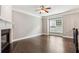 Well-lit living room with hardwood floors, fireplace, and crown molding accents at 2252 Limehurst Ne Dr, Atlanta, GA 30319