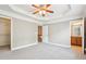 Large bedroom with ceiling fan, trey ceilings, and two entryways at 2252 Limehurst Ne Dr, Atlanta, GA 30319