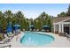 A community pool surrounded by mature trees and lounge seating at 2252 Limehurst Ne Dr, Atlanta, GA 30319