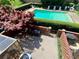 Backyard featuring a patio, a pool, hedges and an enclosed sunroom at 2259 Pernoshal Ct, Dunwoody, GA 30338