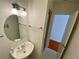 Bathroom with a pedestal sink, framed mirror, and a walk-in shower at 2259 Pernoshal Ct, Dunwoody, GA 30338