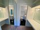 Dual vanity with mirrors, lighting and a shared toilet and shower room at 2259 Pernoshal Ct, Dunwoody, GA 30338