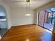 Elegant dining area with hardwood floors and sliding glass doors to the private patio at 2259 Pernoshal Ct, Dunwoody, GA 30338