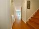 Inviting hallway with hardwood floors, staircase, and view to the living room at 2259 Pernoshal Ct, Dunwoody, GA 30338