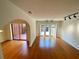 Spacious living room with hardwood floors, access to a covered patio, and ample natural light at 2259 Pernoshal Ct, Dunwoody, GA 30338