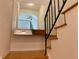 Stairway featuring hardwood steps, a black railing and a mirror that gives an peek into the floor above at 2259 Pernoshal Ct, Dunwoody, GA 30338