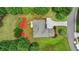 This is an aerial view of a home and its landscaped yard with a driveway and surrounding trees at 3120 Caney Creek Ln, Cumming, GA 30041
