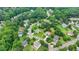 Located in a residential neighborhood, this beautiful two-story home is surrounded by mature trees and lush greenery at 3120 Caney Creek Ln, Cumming, GA 30041