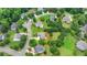 Located in a suburban neighborhood, this two-story home features mature trees, lawn, and colorful landscaping at 3120 Caney Creek Ln, Cumming, GA 30041