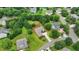Situated on a verdant lot, this two-story home is framed by mature trees and colorful, well-maintained landscaping at 3120 Caney Creek Ln, Cumming, GA 30041