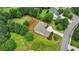 Set on a green lot, this two-story home is surrounded by mature trees and well-maintained landscaping at 3120 Caney Creek Ln, Cumming, GA 30041