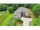 Charming two-story home surrounded by vibrant landscaping and a well-maintained lawn creates a welcoming atmosphere at 3120 Caney Creek Ln, Cumming, GA 30041