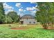 Expansive backyard with garden and lush lawn, ideal for outdoor activities and enjoying nature's beauty at 3120 Caney Creek Ln, Cumming, GA 30041