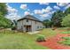 The large backyard showcases manicured landscaping and offers plenty of space for outdoor activities and relaxation at 3120 Caney Creek Ln, Cumming, GA 30041