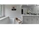 Primary bath boasts large soaking tub, custom window and double vanity with marble countertops at 3120 Caney Creek Ln, Cumming, GA 30041