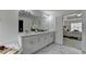 Primary bath featuring a large soaking tub, glass enclosed shower, and custom double vanity at 3120 Caney Creek Ln, Cumming, GA 30041