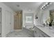Beautiful primary bathroom featuring a soaking tub, glass shower, and modern double sink vanity at 3120 Caney Creek Ln, Cumming, GA 30041