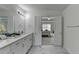 Primary bathroom featuring a double vanity with modern finishes and an opening to the bedroom at 3120 Caney Creek Ln, Cumming, GA 30041