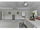 Spacious bedroom with tray ceiling, carpet flooring, two windows and stylish lamps at 3120 Caney Creek Ln, Cumming, GA 30041